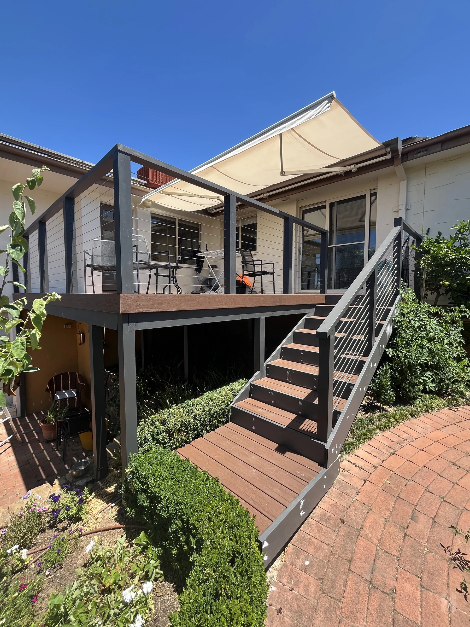 Elevated Canberra deck with stairs and modern black balustrade