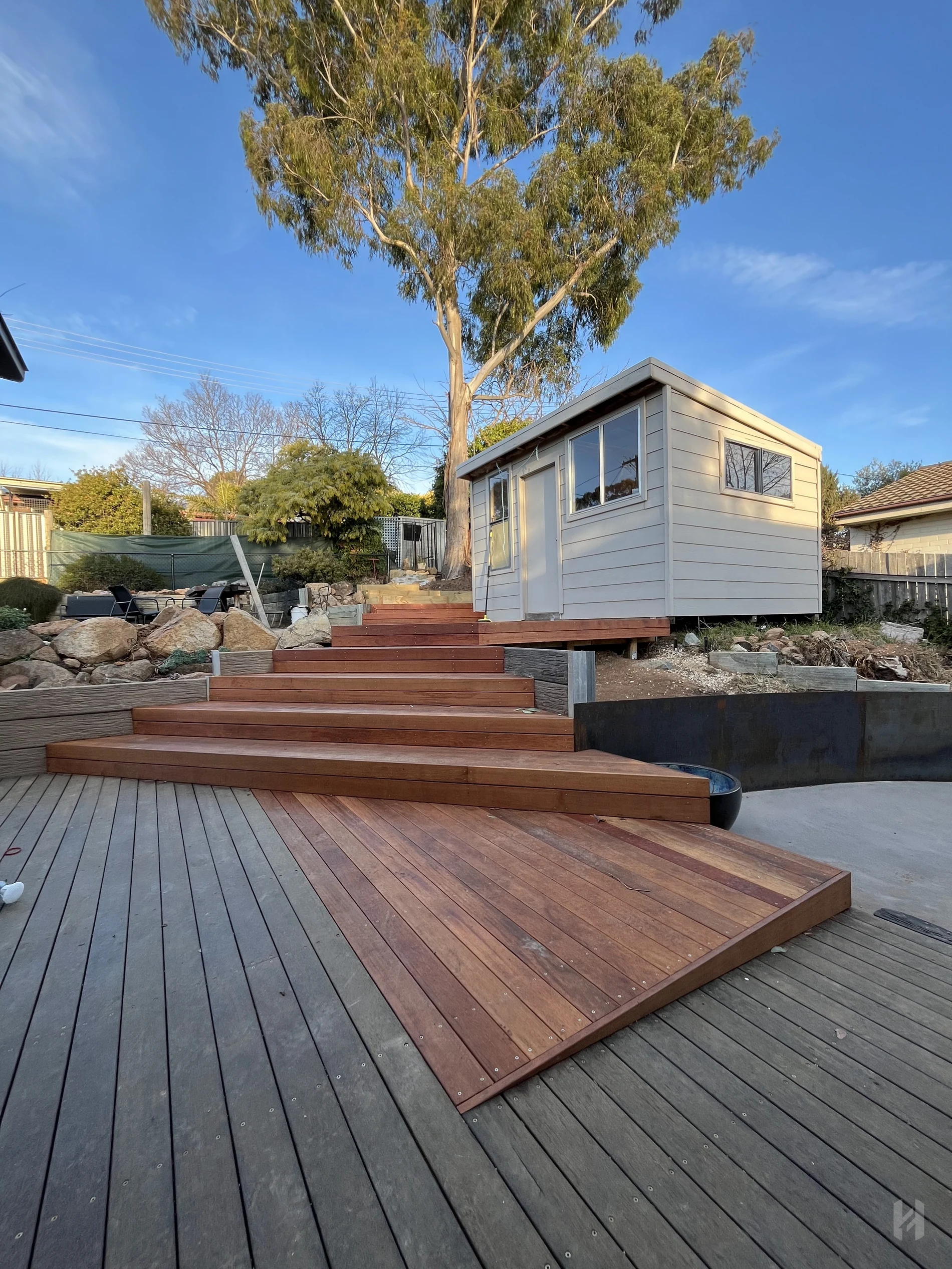 Multi-level timber decking and wide outdoor stairs for a Canberra home